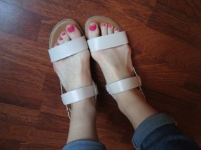 Graceland sandals feat. sloppily-painted toe nails.